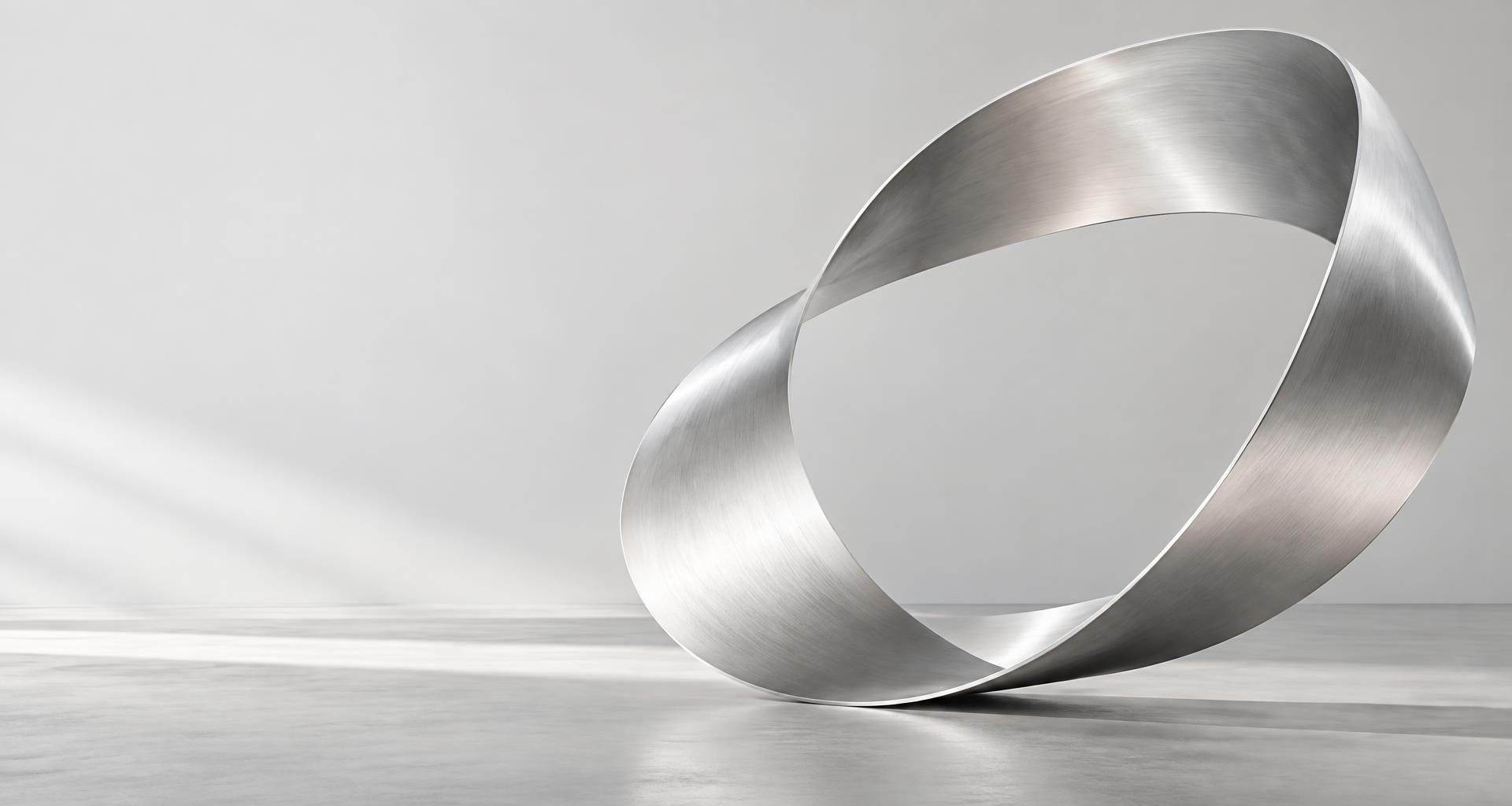 A sculptural silver ribbon connecting into one continuous form